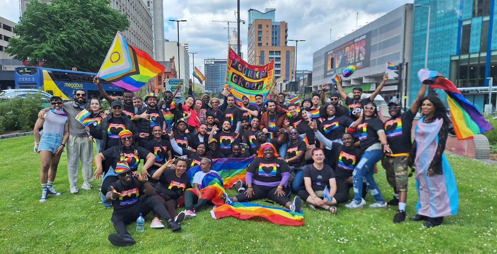 A large group of Journey members in rainbow colours