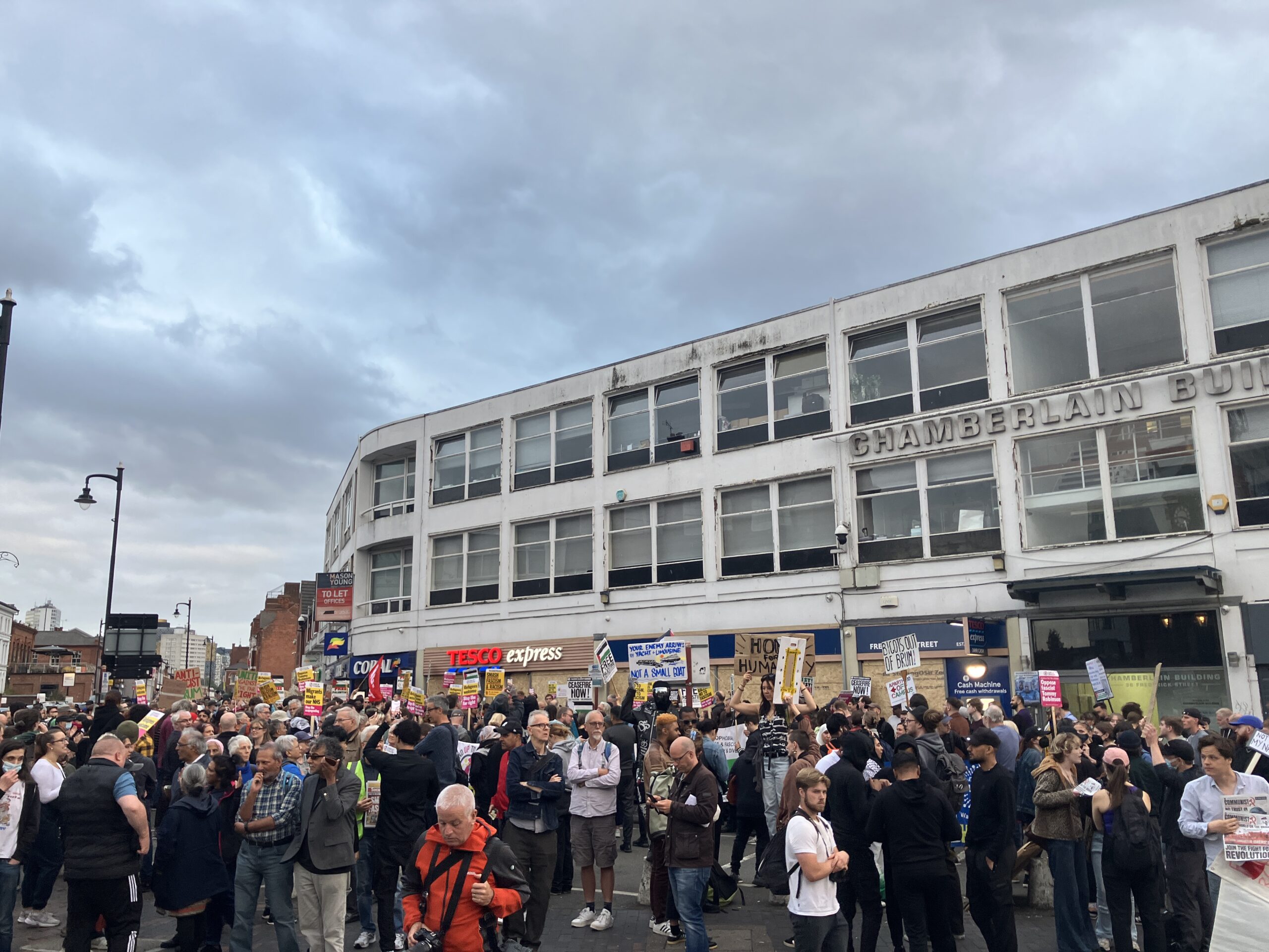 A photo of hundreds of people gathered to peacefully protest