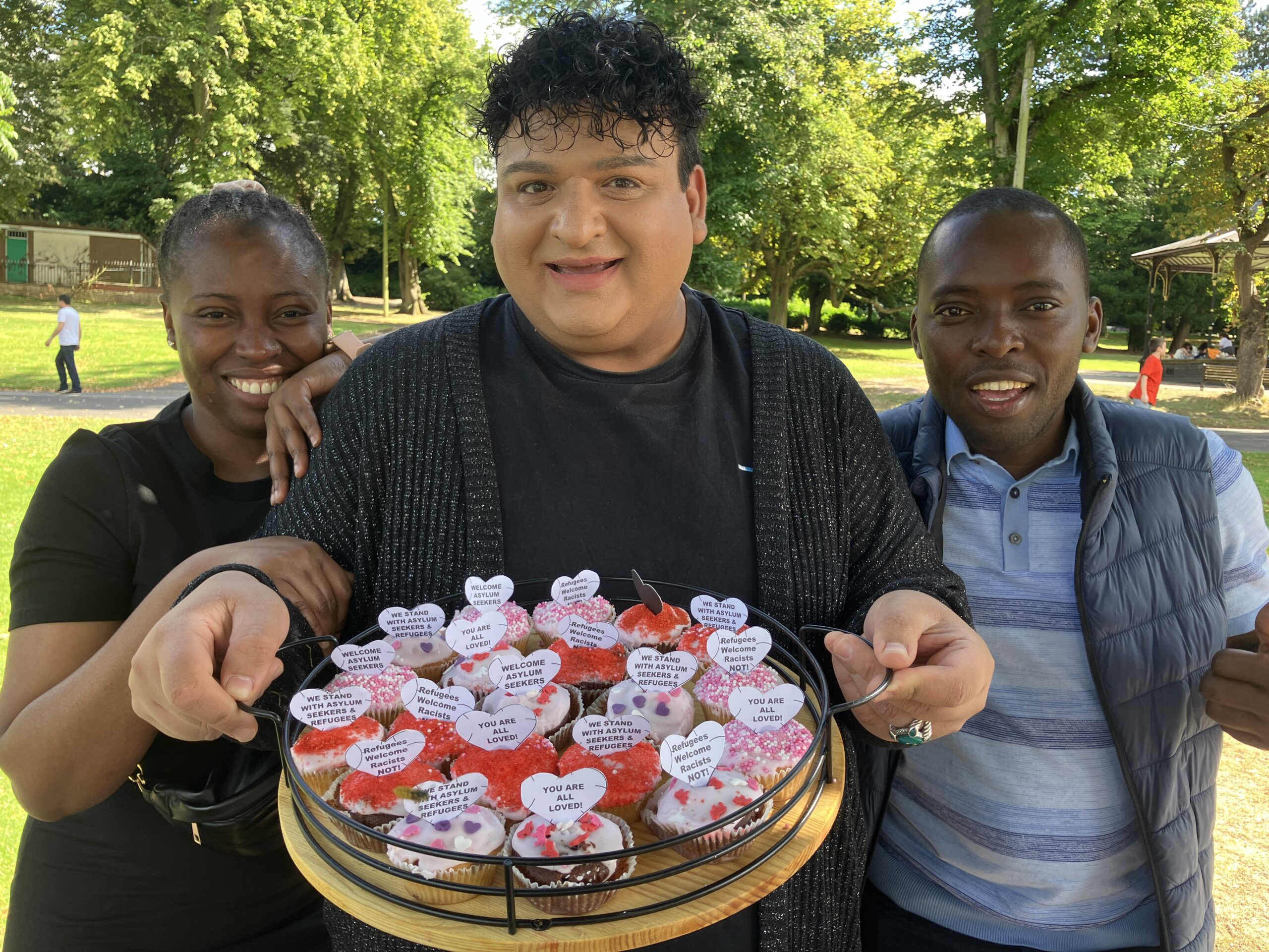 Etah, Naz and Cedric, with a plate of Naz's cupcakes